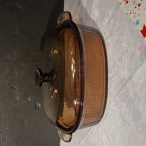 Vintage Corning Visions Amber 4-quart oval roaster with a lid. 